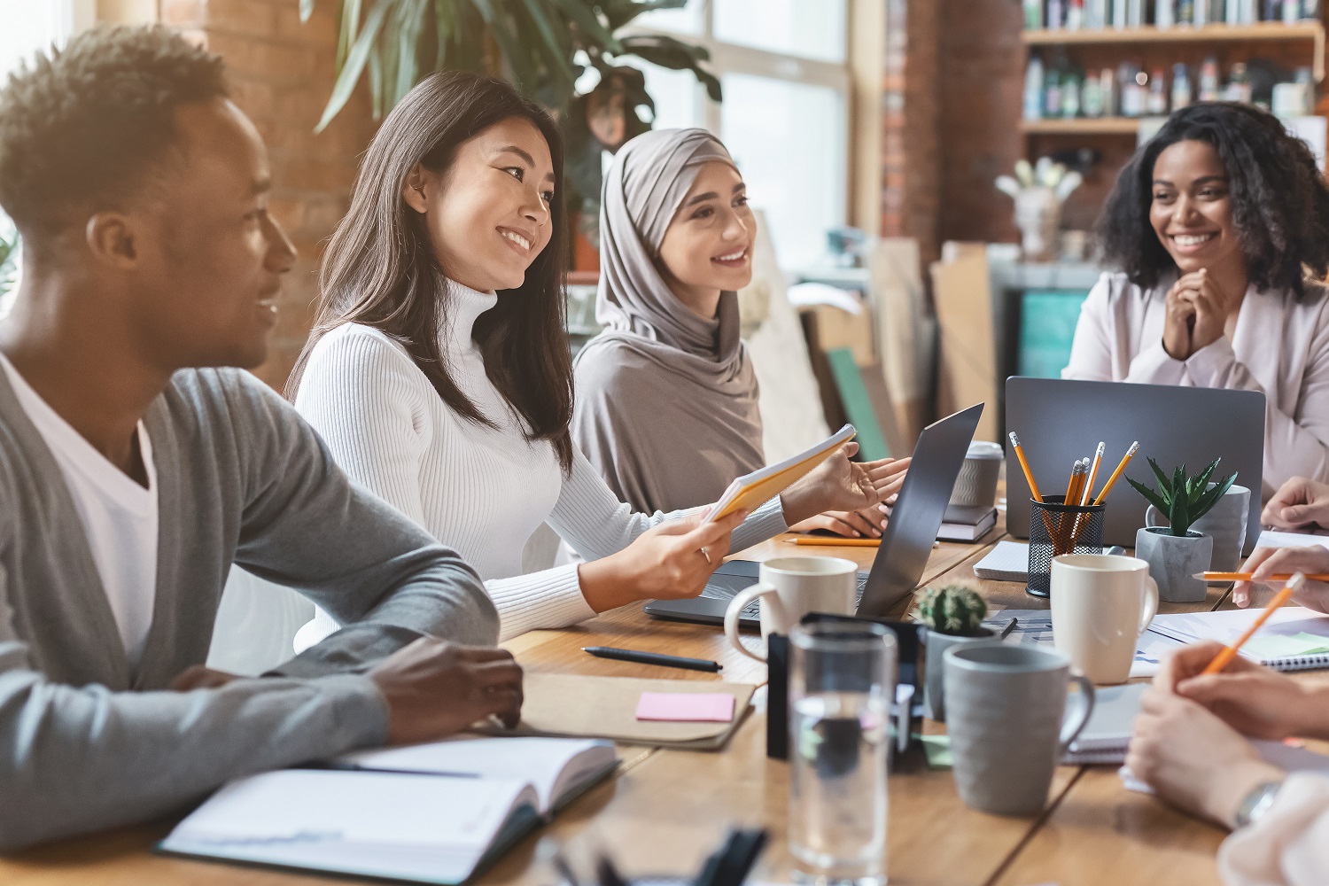 A diverse early-career team collaborating